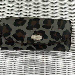 Coach multifunction wallet with extra pouch.